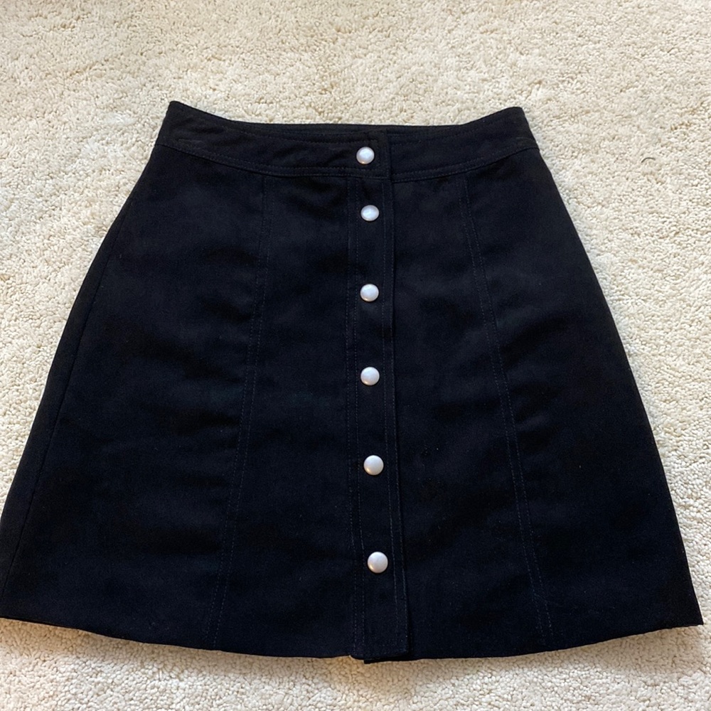 H&M black suede skirt with silver snap buttons in front. Size: Xsmall.